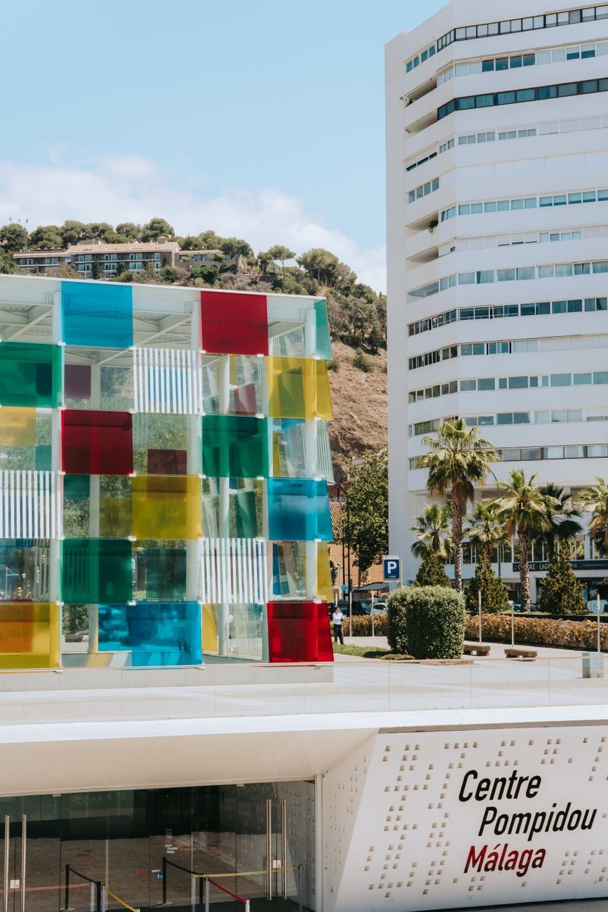 The colored glass cube of the Centre Pompidou Málaga at Muelle Uno.